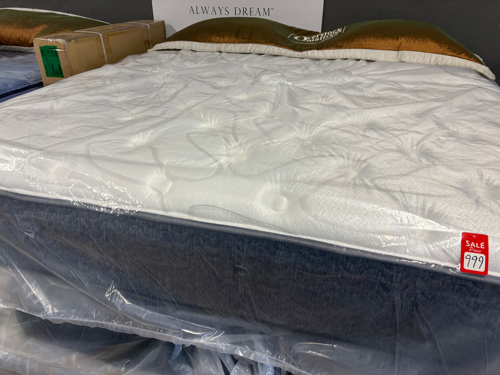White-topped mattress with dark sides on the showroom floor